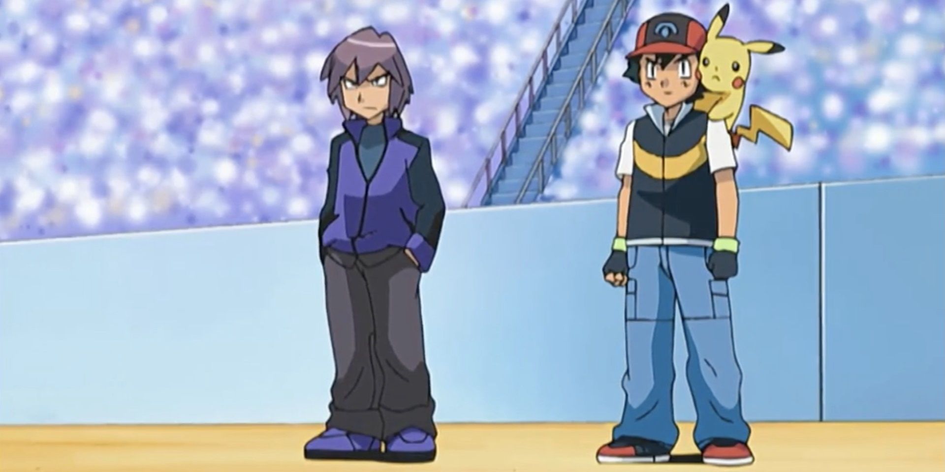 Ash and Paul stand next to each other in an arena in Pokémon.