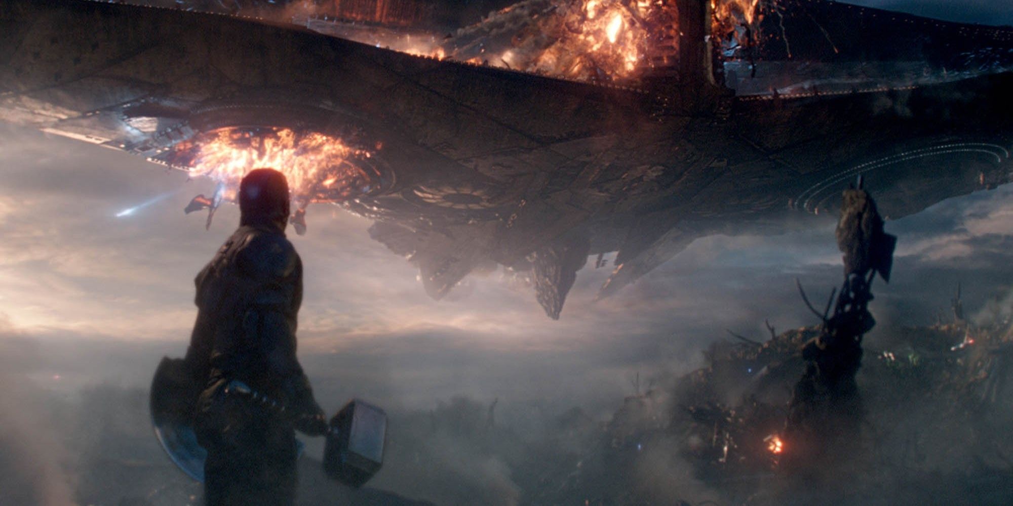 Captain America watches Thanos' ship over the rubble