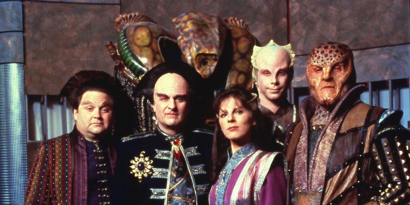 The cast of Babylon 5 standing together and smiling. 