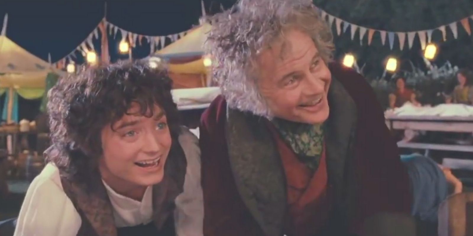 Frodo and Bilbo Baggins looking excitedly during Fellowship of the Ring's birthday party