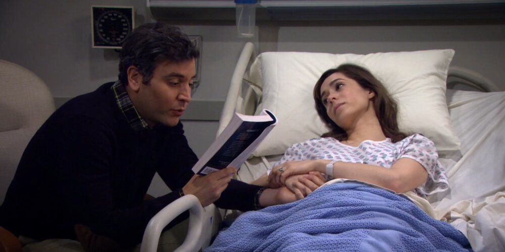 Ted reads to Tracy in the hospital in How I Met Your Mother finale.