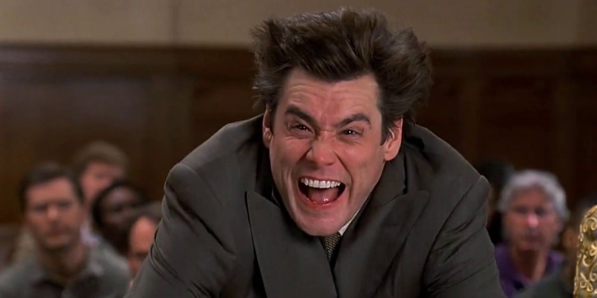 Jim Carrey's Liar Liar characters laughs at the front of a courtroom