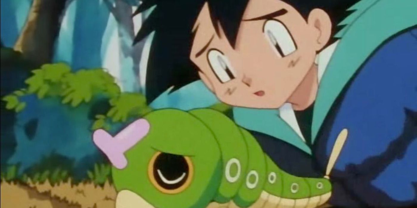 Ash in a sleeping bag with caterpie in the Pokemon anime