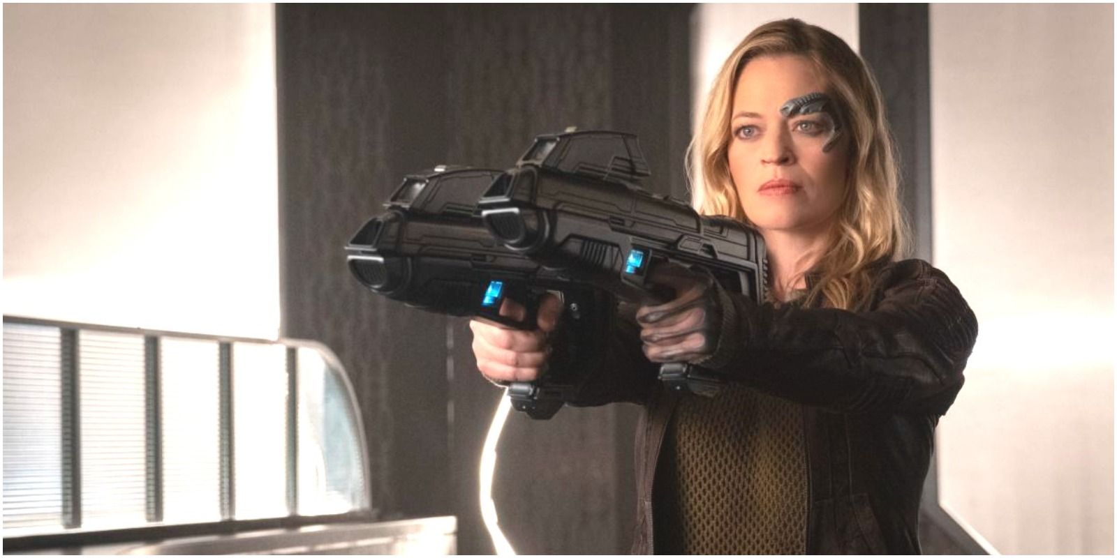 An older Seven of Nine with blasters from the Picard Series