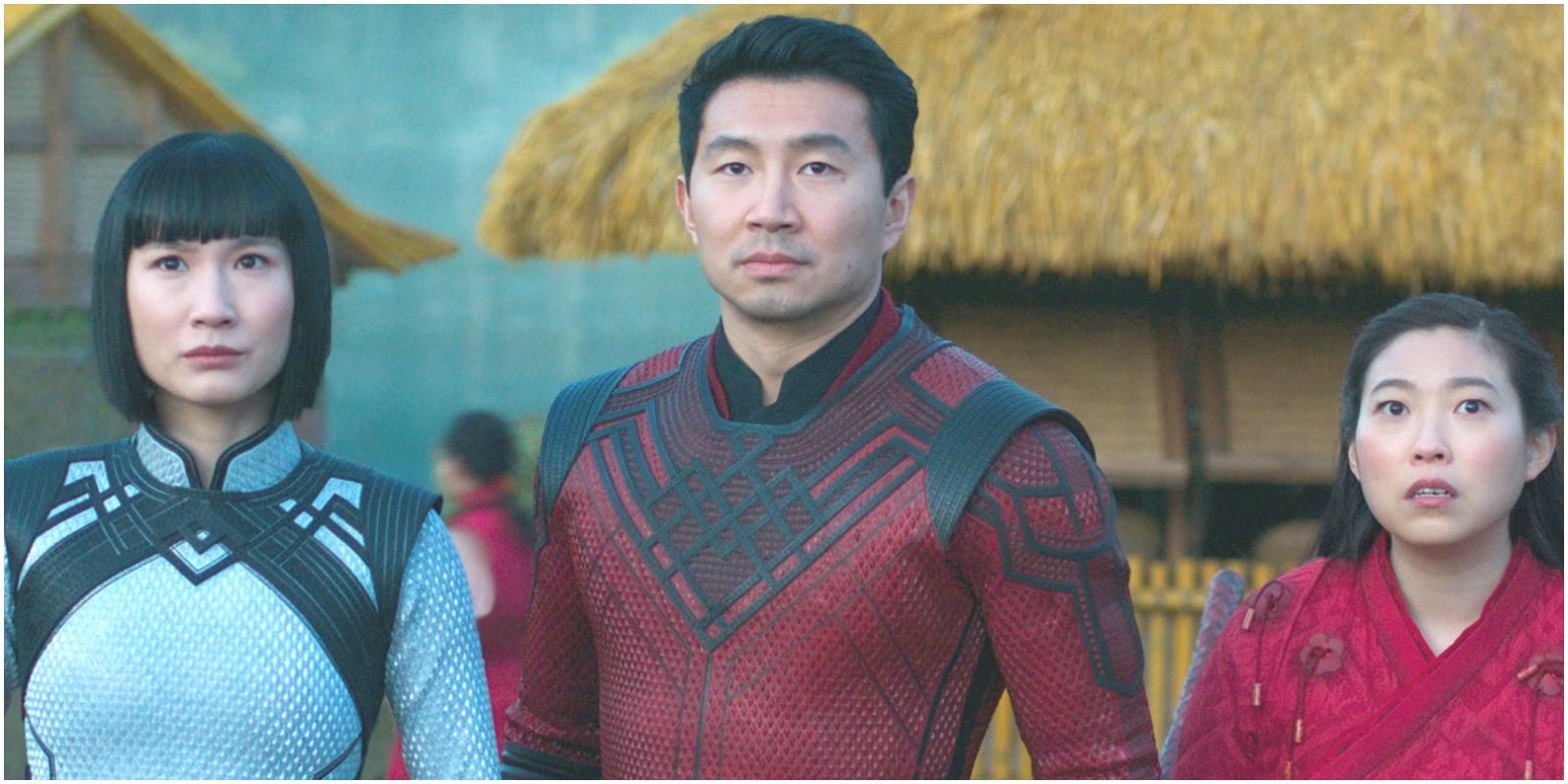 Shang Chi and his sister wearing Dragon Scale Suits given to them by their mother from the film