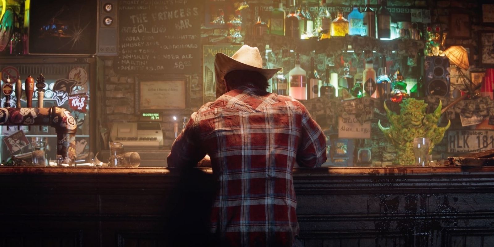 Wolverine, dressed in a cowboy hat and flannel shirt, sits at a bar in Insomniac Games' upcoming title