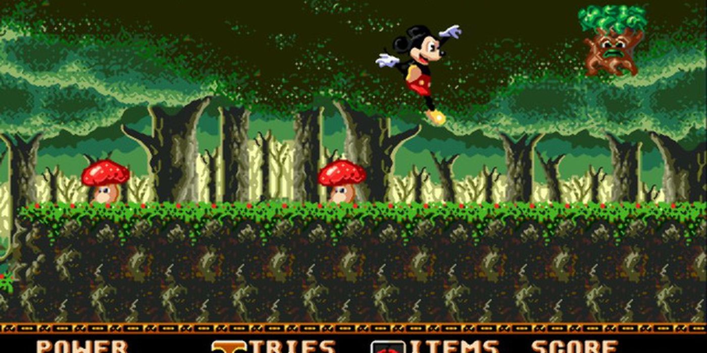 Mickey salta a través de un bosque en Castle of Illusion.