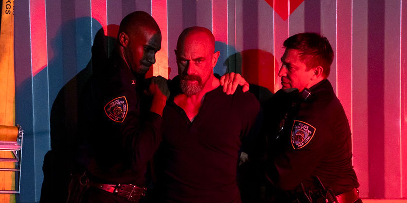 Elliot Stabler is detained by two uniformed police officers in Law & Order: Organized Crme