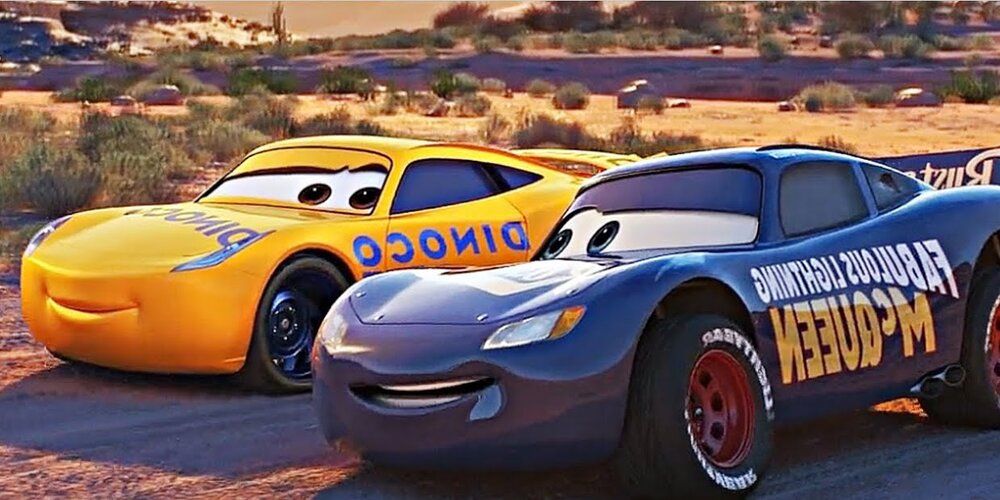 A pair of Cars next to one another in a music video for Cars 3