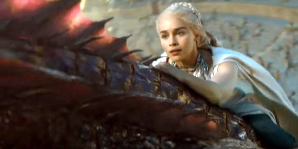 Daenerys rides Drogon away from the Sons of the Harpy in Game of Thrones