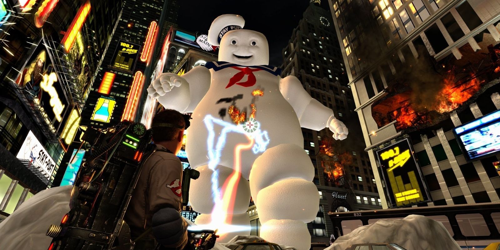 The Stay-Puft Marshmallow Man being lasered down by a Ghostbuster in the video game