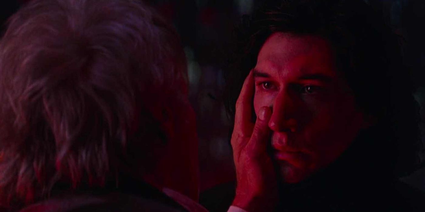 Han touching Kylo Ren's face in The Force Awakens