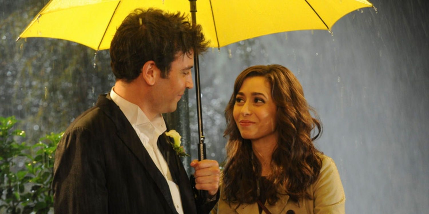 Ted and Tracey in the rain underneath a yellow umbrella