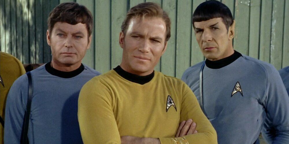 Captain Kirk, Mister Spock and Dr McCoy standing together Star Trek
