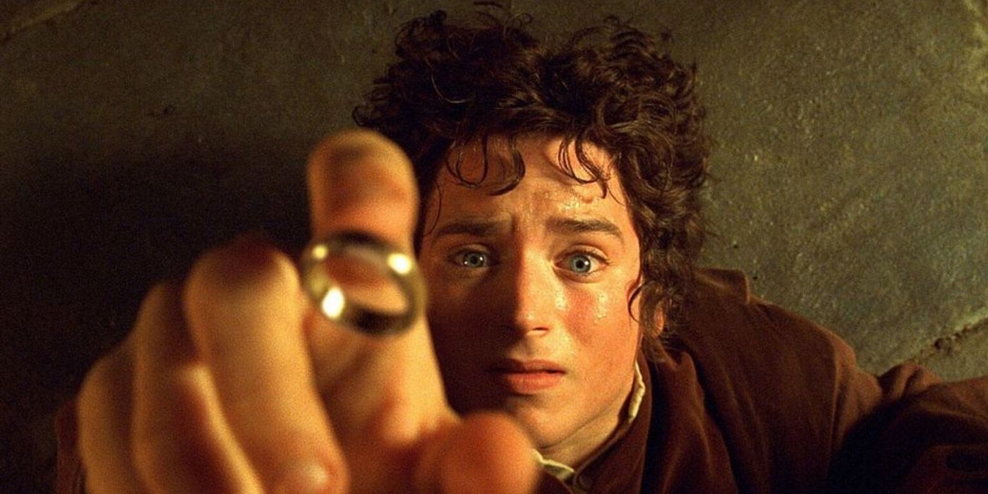 Frodo reaching out to catch the One Ring as it falls 