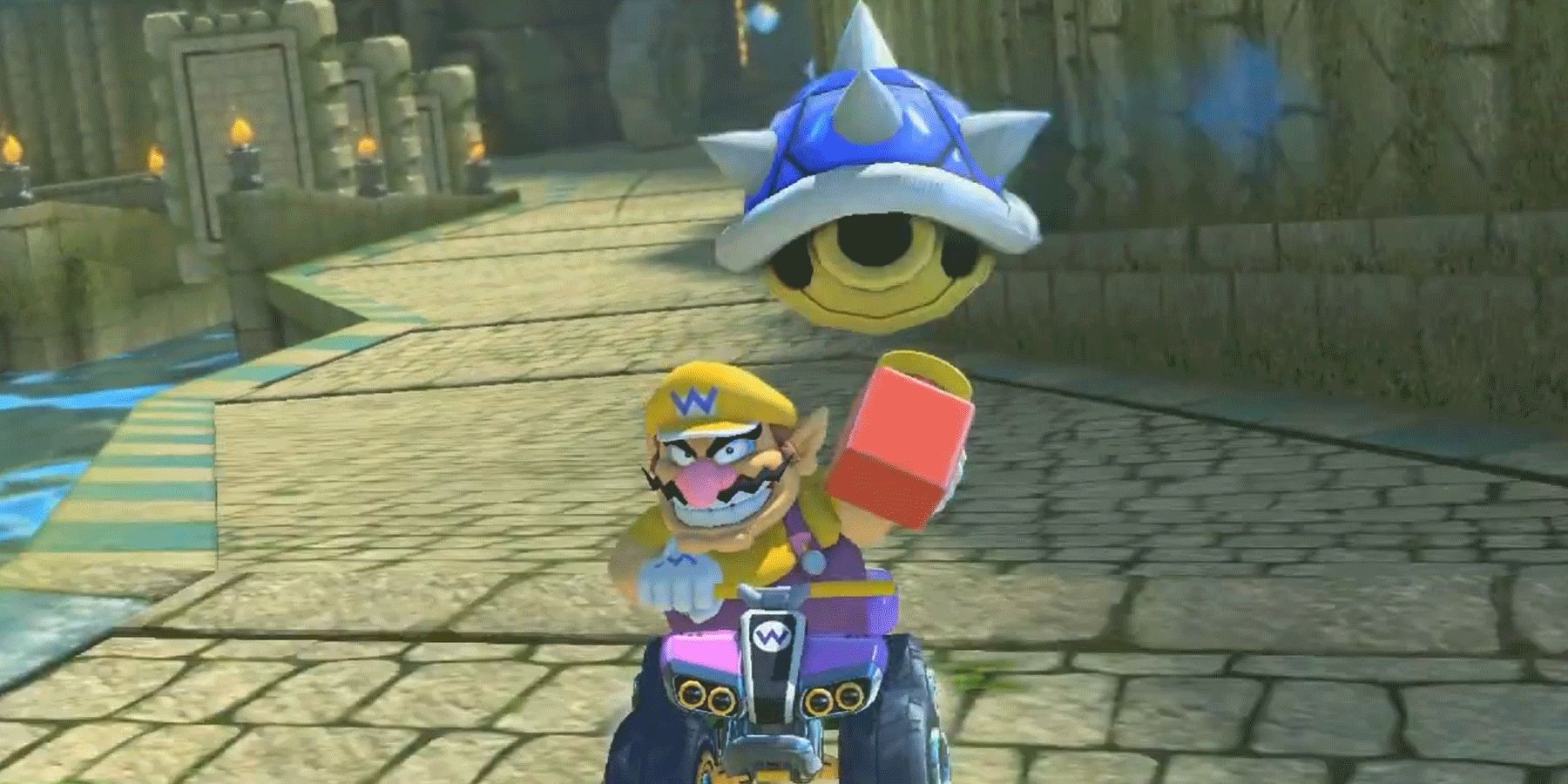 Wario with a Super Horn about to be hit by a Blue Shell