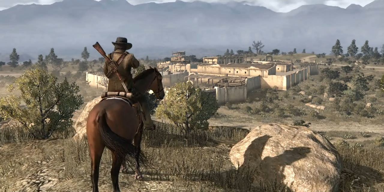 John Marston on a horse overlooking a fort in Red Dead Redemption.