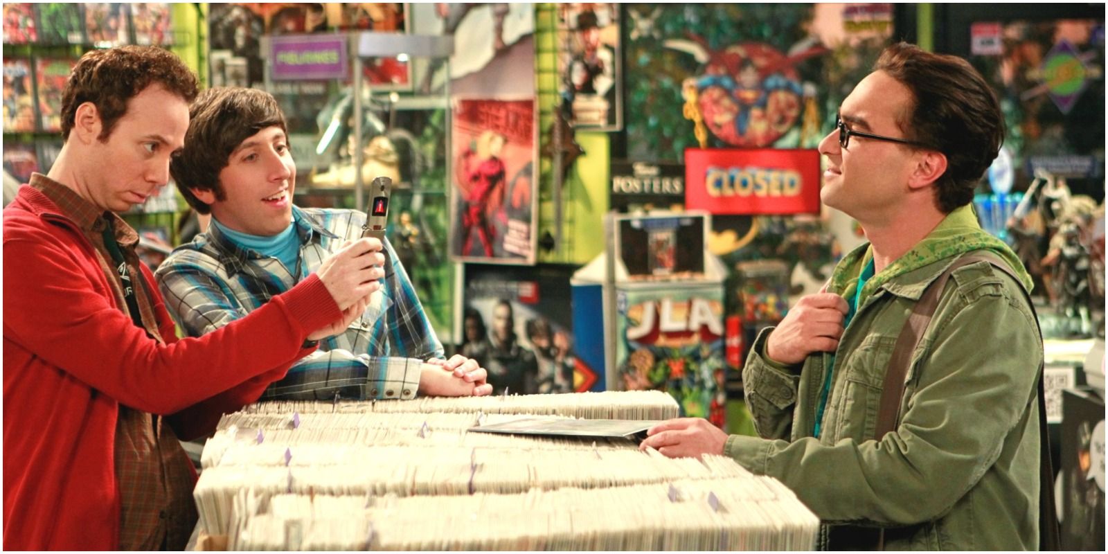 Stuart and Howard taking a photo of Leonard at the comic book store from the Big Bang Theory