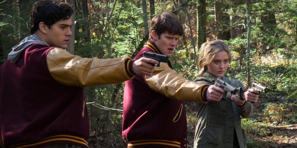 Three teens pointing guns in Netflix's The Society