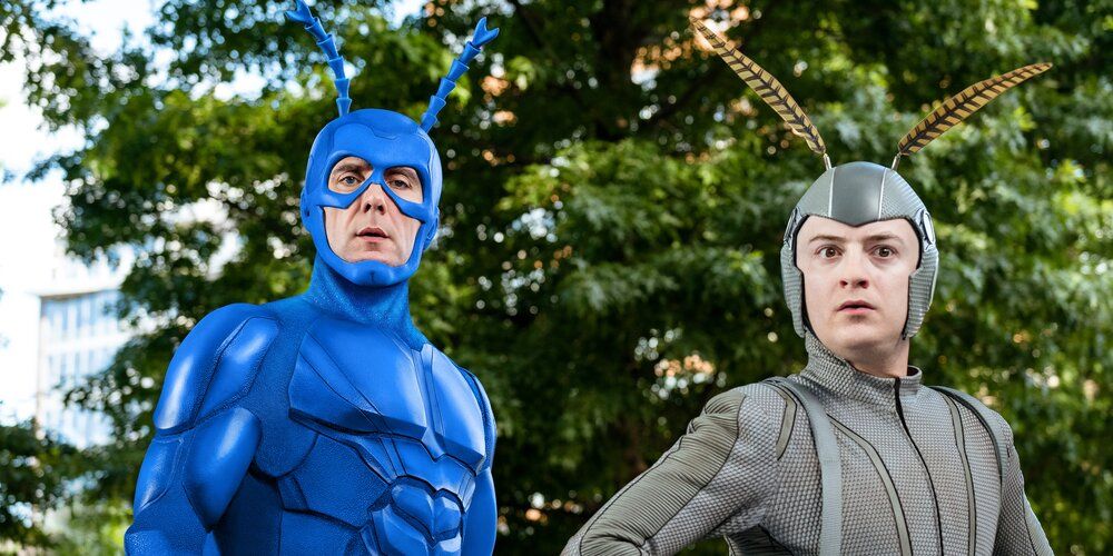 Peter Serafinowicz as the Tick, standing with his partner Arthur