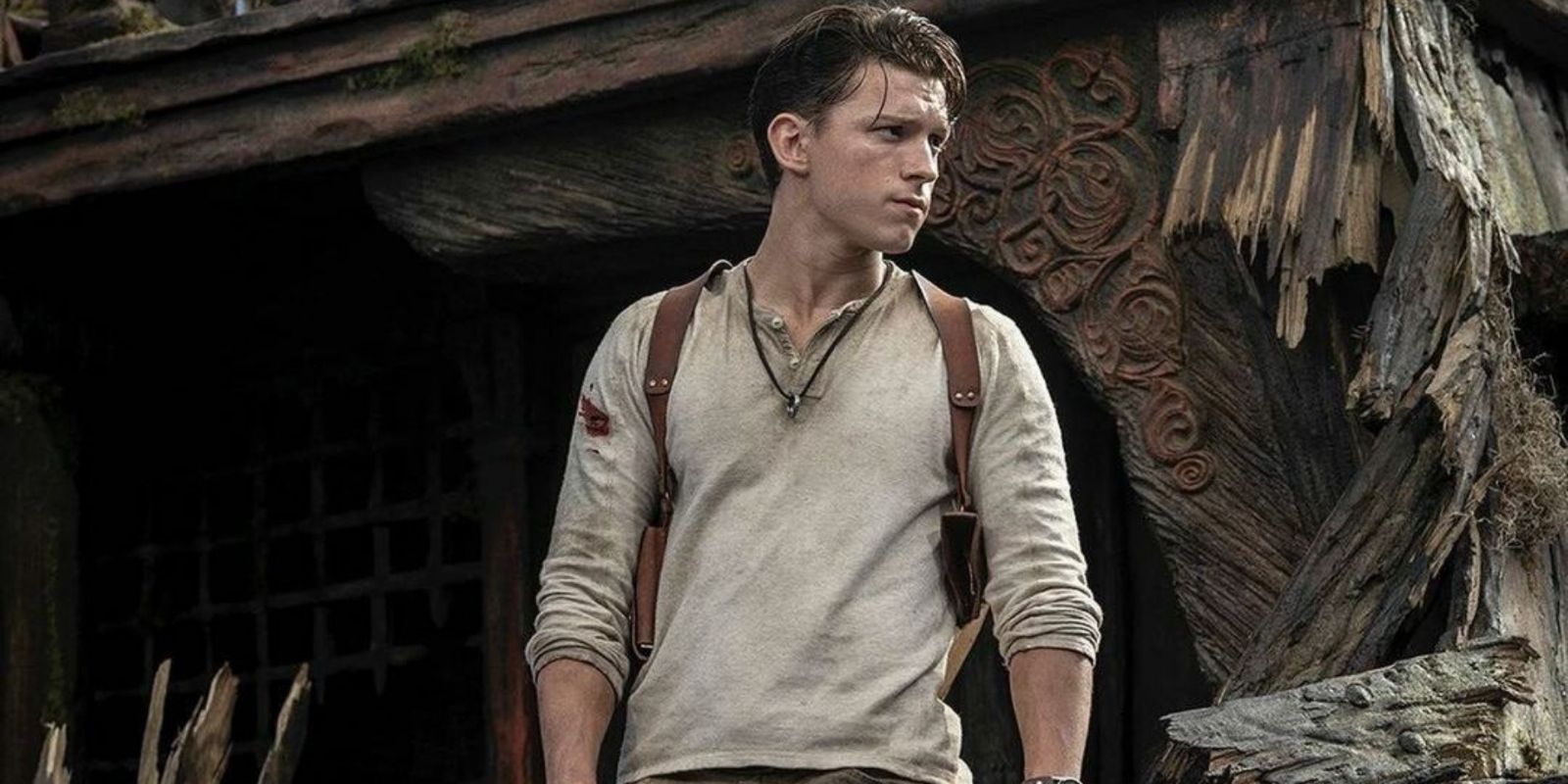 Tom Holland, standing amongst debris in the Uncharted movie