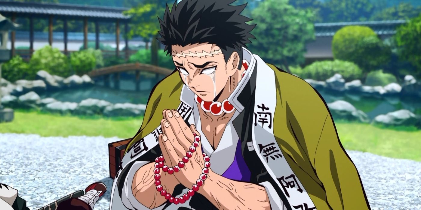Gyomei Himejima, the Stone Pillar Hashira, praying as tears run over his cheeks