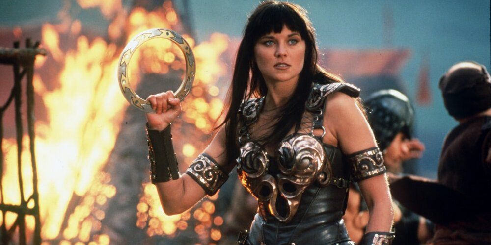 Lucy Lawless brandishing a weapon as Xena: Warrior Princess