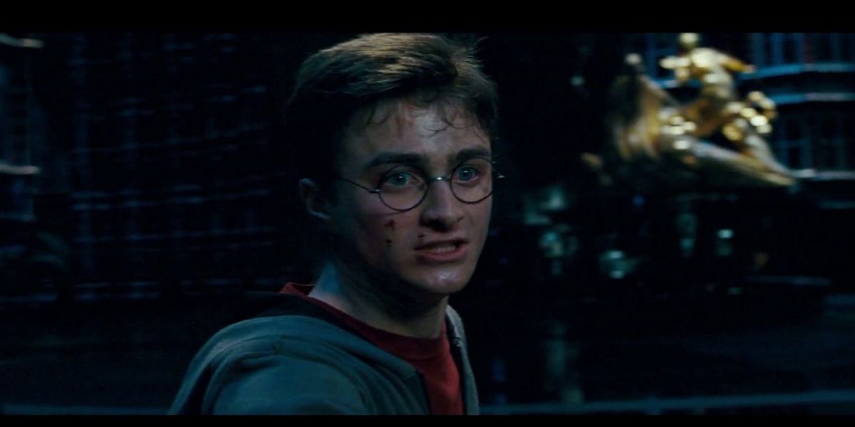 Harry looking heart-broken after Sirius falls through the veil in Harry Potter and the Order of the Phoenix