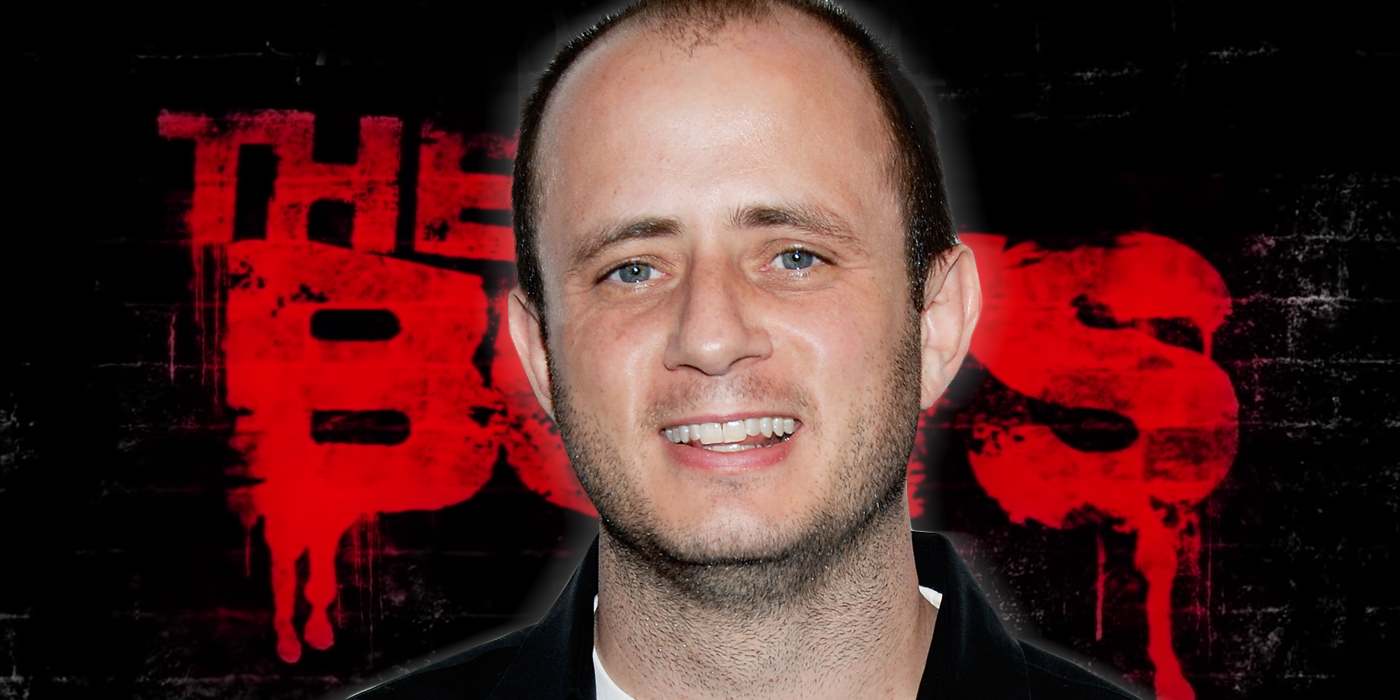 A picture of showrunner Eric Kripke in front of The Boys logo.