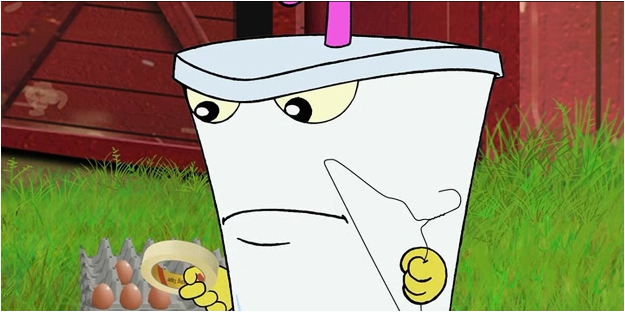master shake holding a wire hanger and tape