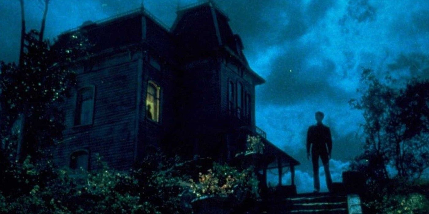 Psycho II movie poster with Norman Bates standing near his house.