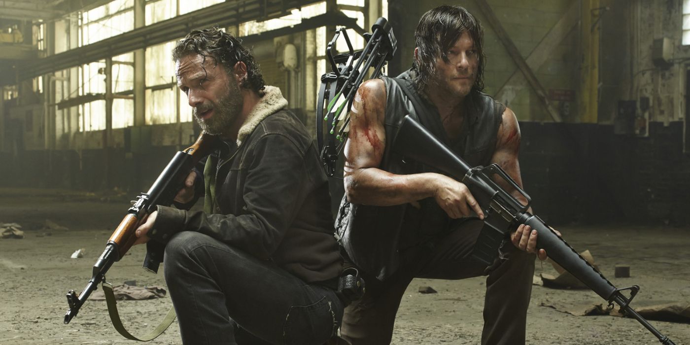 the walking dead rick and daryl crouched with guns