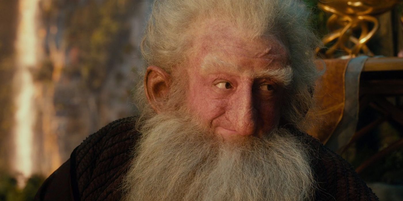 A close-up of Balin smiling while sat down in The Hobbit