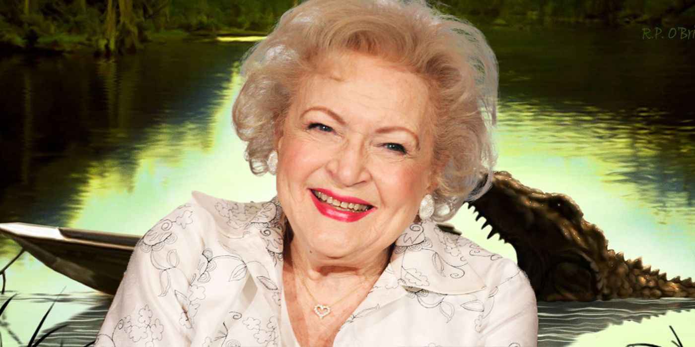 Betty White smiles, and a crocodile opens its jaws in the background.