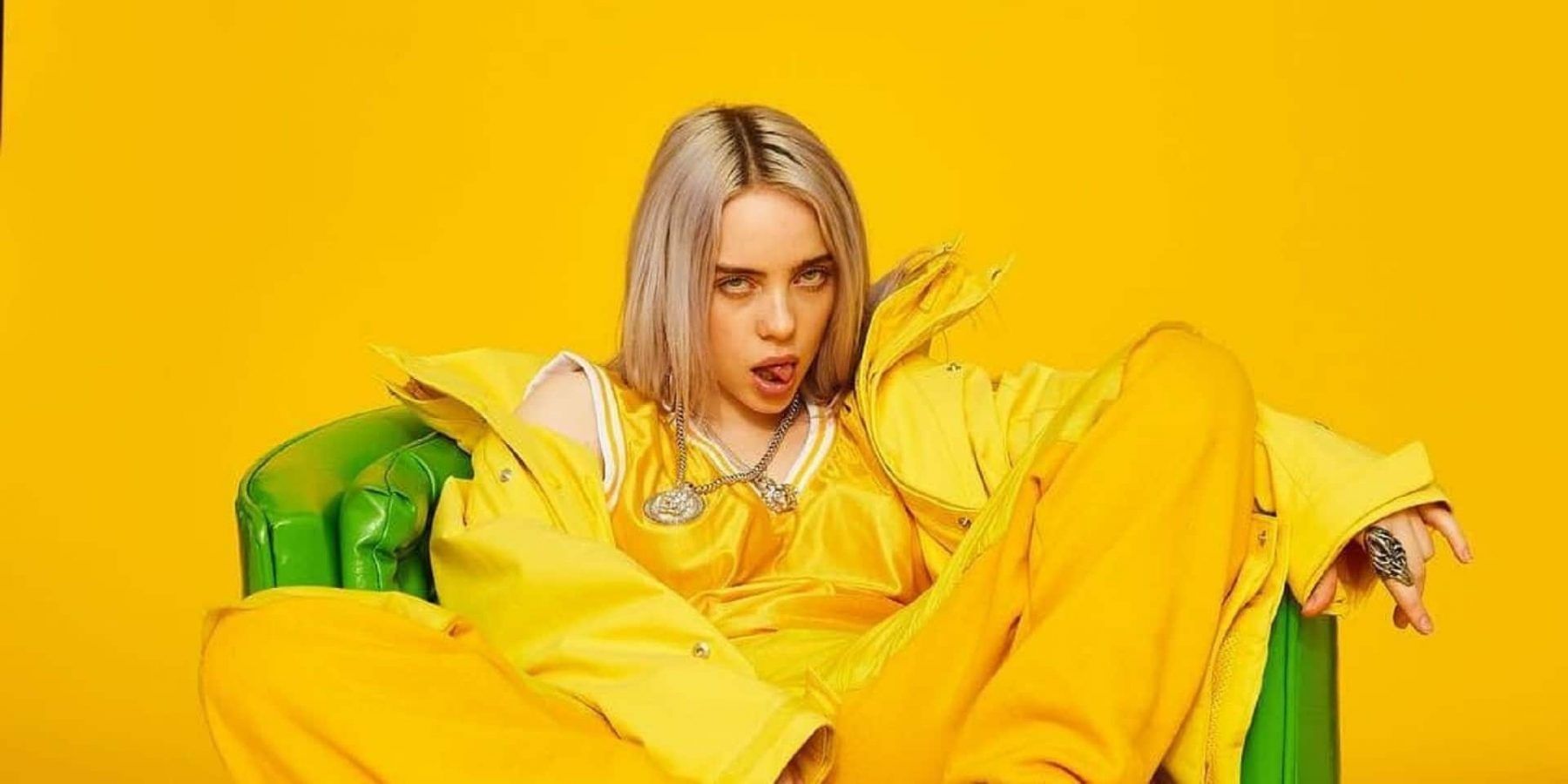 Billie Eilish with a yellow background
