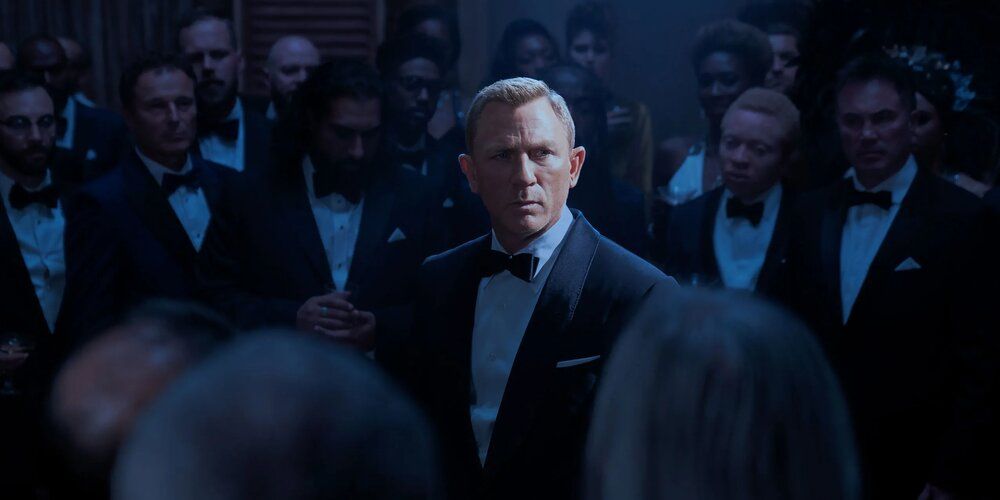 James Bond surrounded by agents of Spectre in No Time To Die