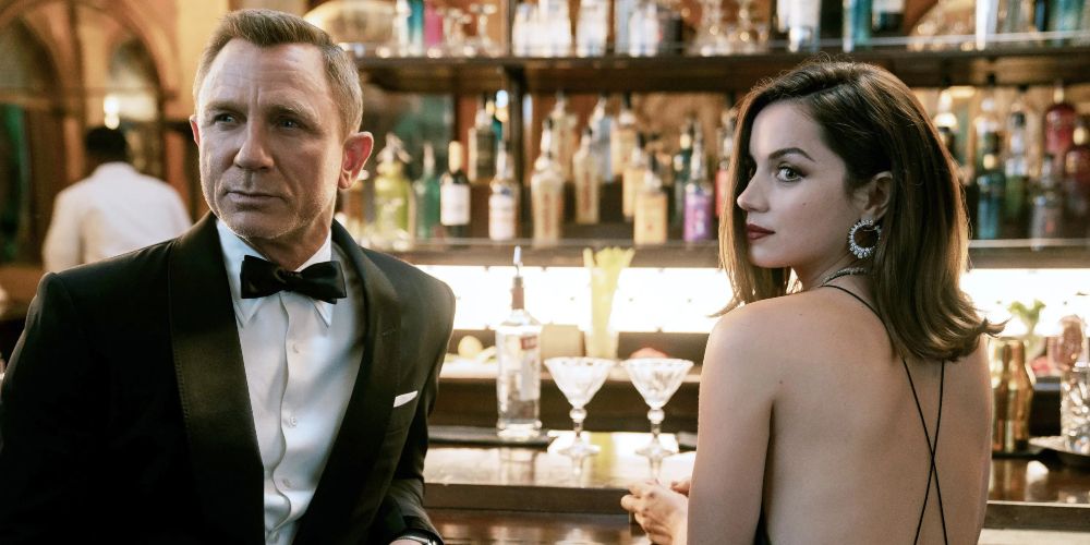 Bond shares a drink with Paloma before a mission in No Time to Die