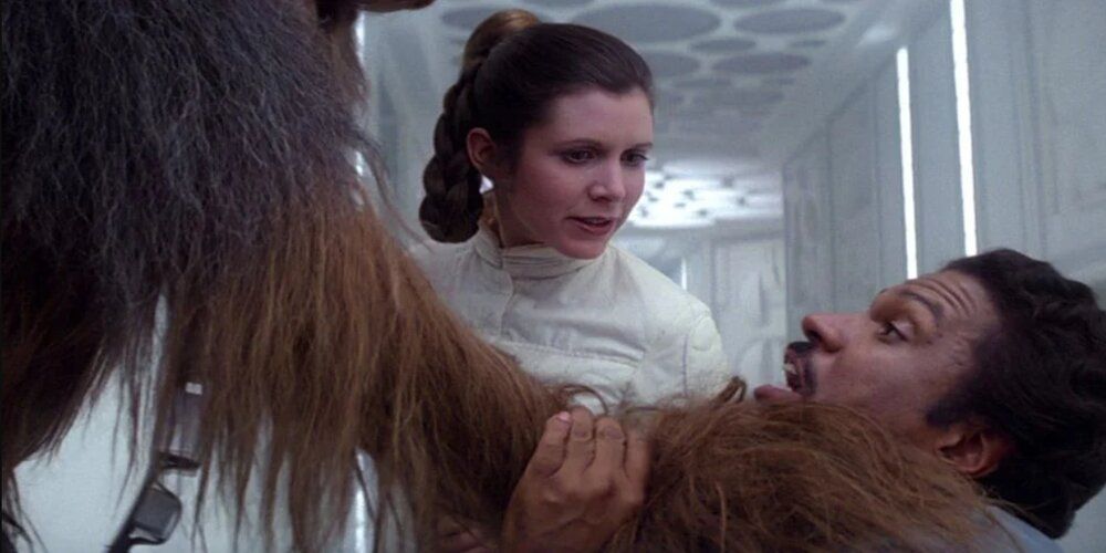 Chewie strangles Lando after the latter frees him and Leia Star Wars