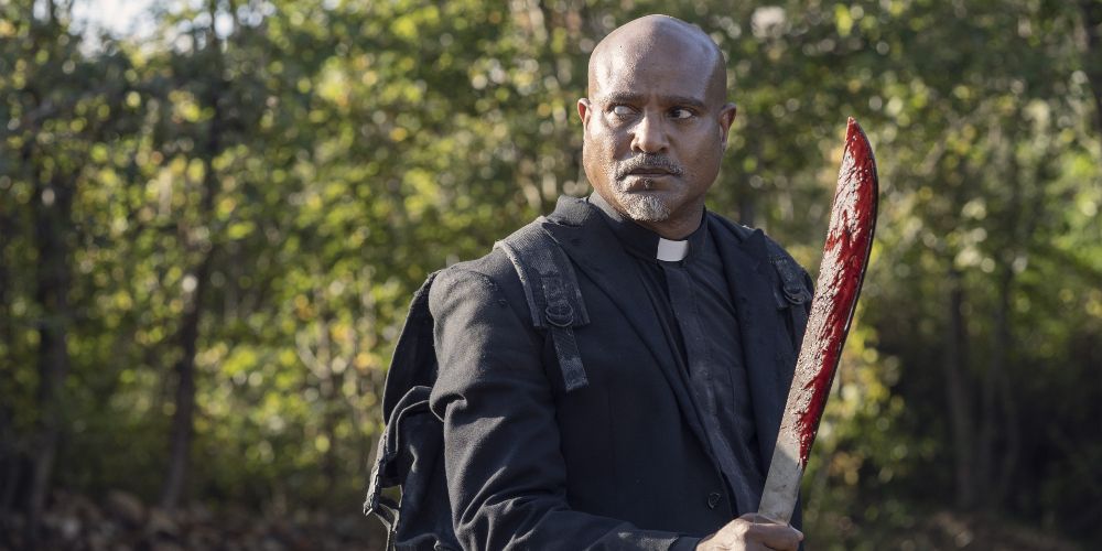 Father Gabriel brandishing a bloody machete in the Walking Dead