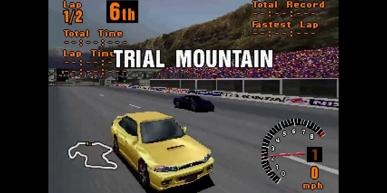Yellow vehicle racing at Trial Mountain in Gran Turismo 2