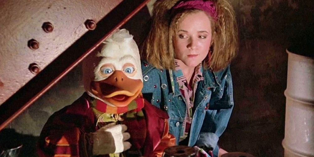 Howard the Duck sitting with a girl in the Howard the Duck Movie