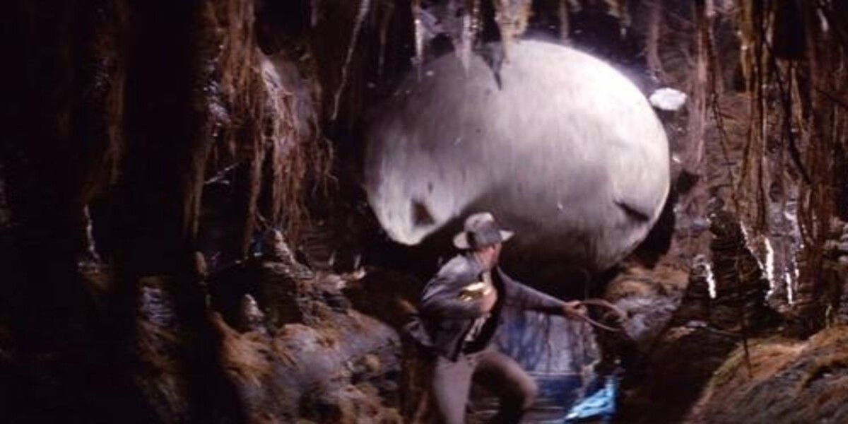 Indiana Jones runs from a boulder in Raiders Of The Lost Ark