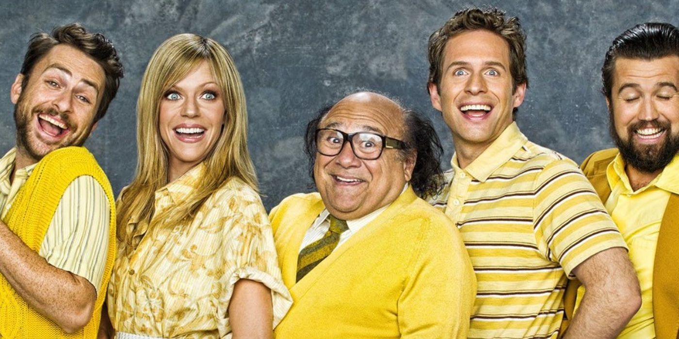 It's Always Sunny In Philadelphia's Main Cast all wear yellow and smile freakishly 