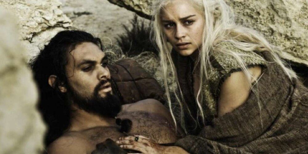 Daenerys (Emilia Clarke) watches Khal Drogo (Jason Momoa) lie catatonic following the blood magic ritual in Game of Thrones.