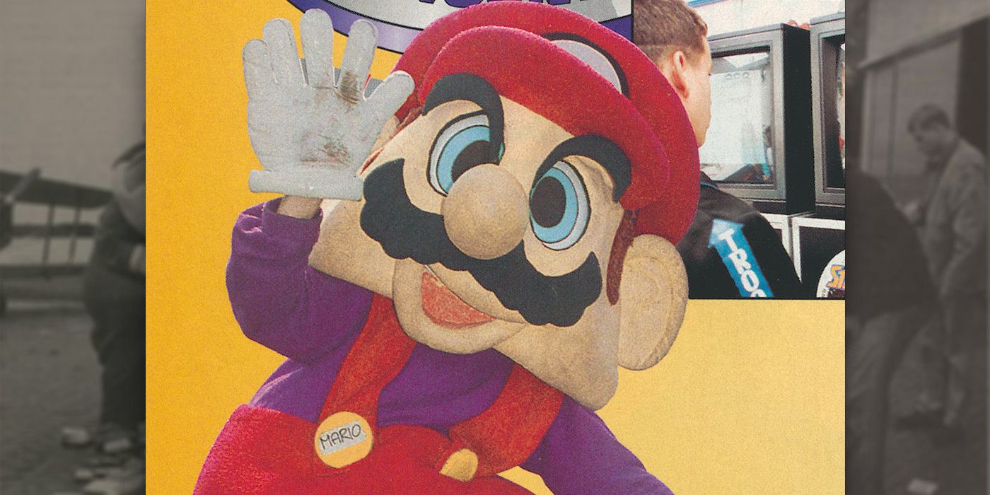 A Mario mascot outfit posing in a Dutch newspaper.