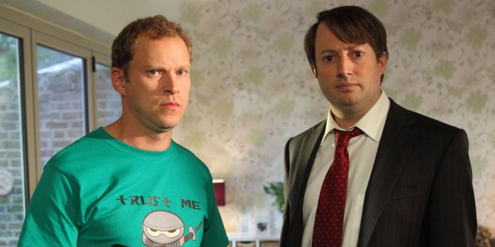 Mark Corrigan and Jeremy Usborne looking at the camera in Peep Show