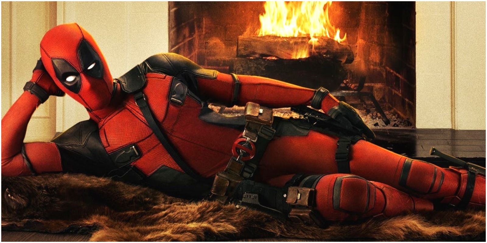 Deadpool lying seductively by the fire from first Deadpool film