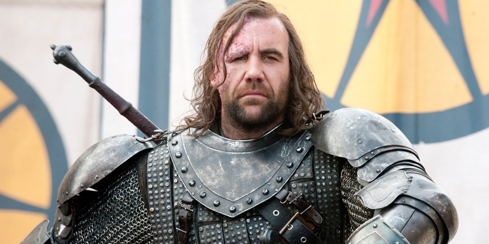 Sandor Clegane (Rory McCann) watches a tourney with an inscrutable expression in Game of Thrones
