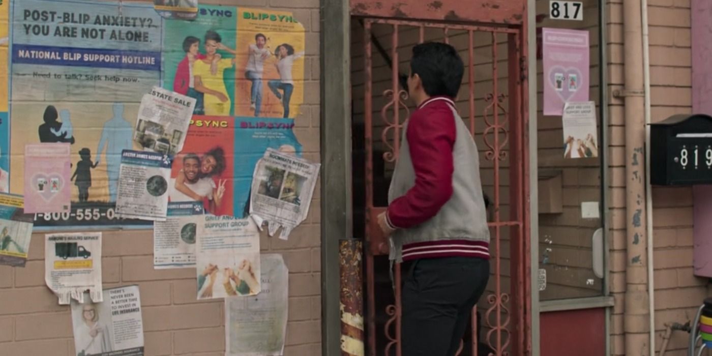 Shawn walks into Katy's building next to a post-blip anxiety poster in Shang-Chi