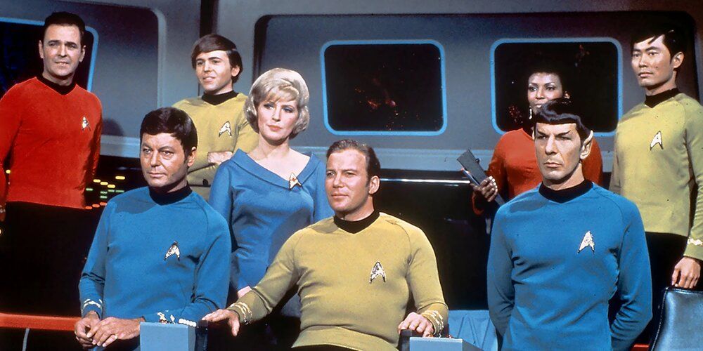The original bridge crew, including Kirk, Spock, Uhura, Sulu, and Chekov in Star Trek